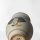 Vintage ceramic vase with bird decoration, signed.