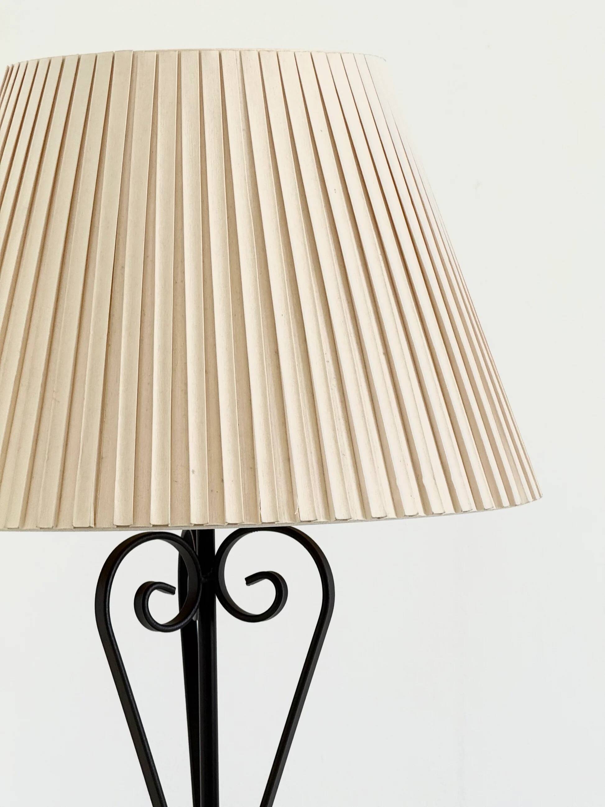 Vintage wrought iron table lamp in swirl shape with pleated shade