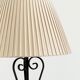 Vintage wrought iron table lamp in swirl shape with pleated shade