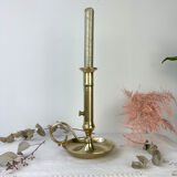 Brass candle holder with pusher late nineteenth century