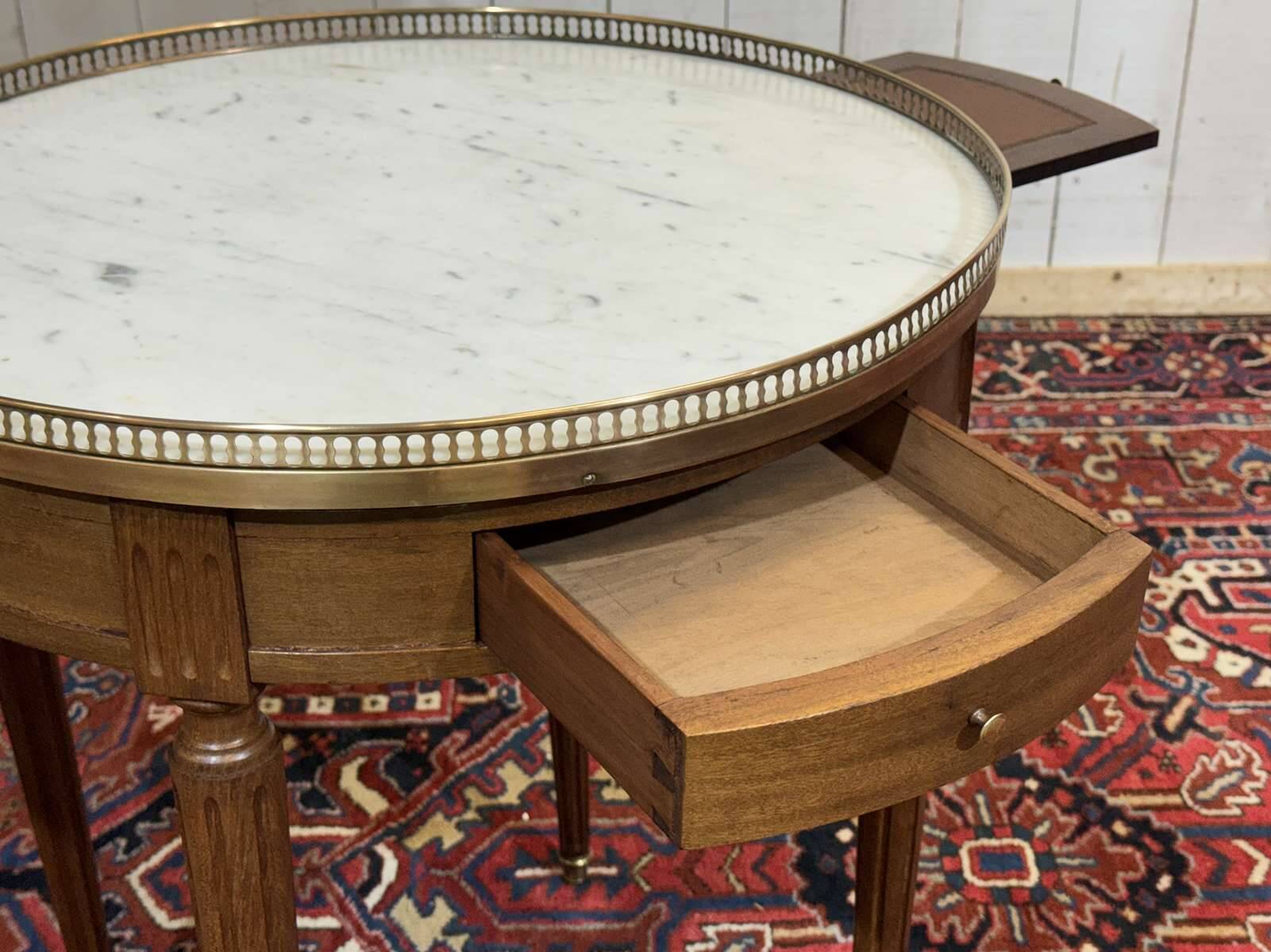 Louis XVI style bouillotte table from the 1960s in mahogany with a marble top.