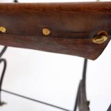 Curule armchair in wrought iron and leather