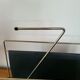 Vintage metal magazine rack in gold and black vinyl Newspaper holder