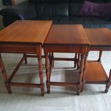 Nesting tables in solid cherry wood held together by slides