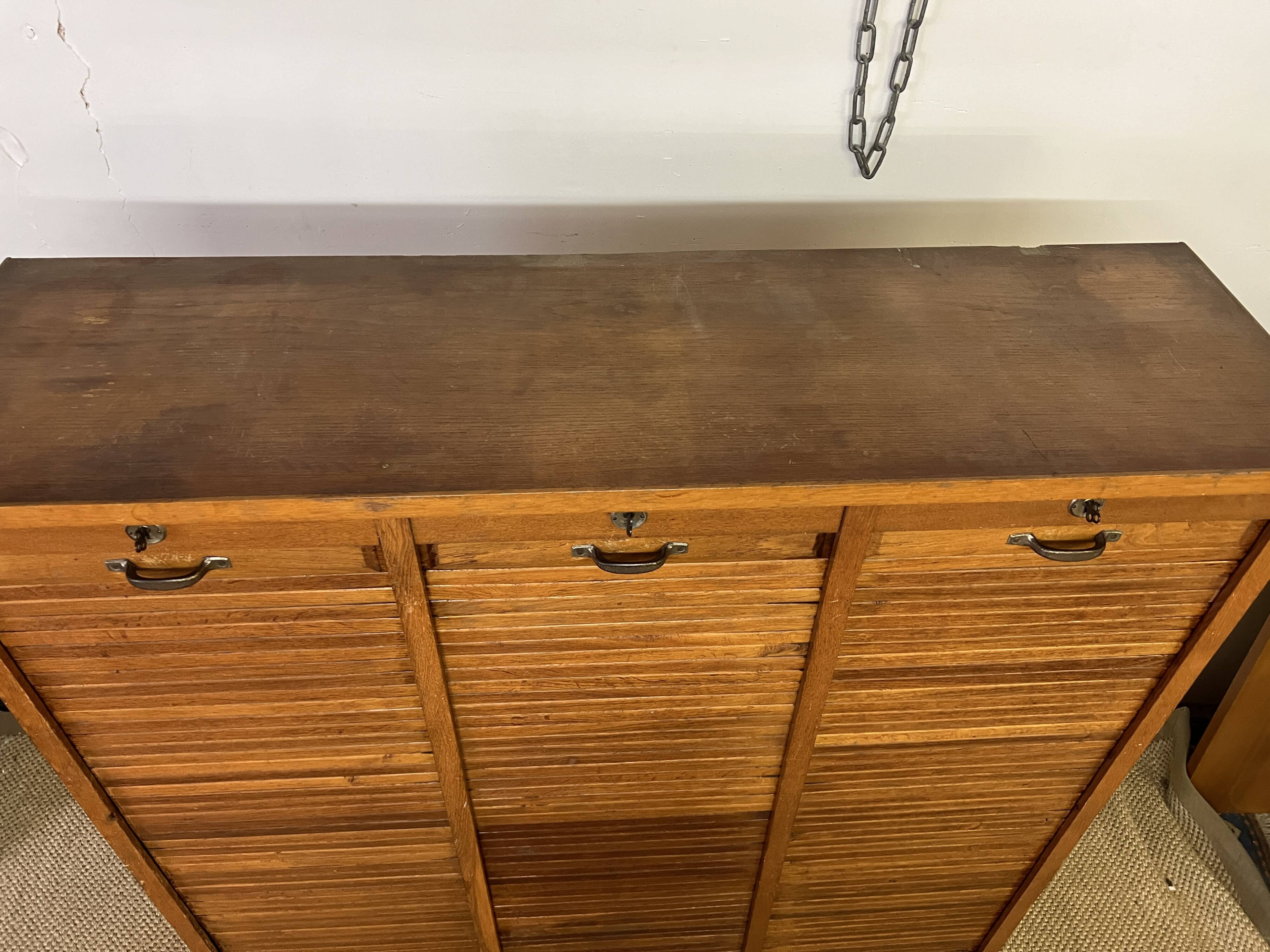 Old filing cabinet with triple curtains