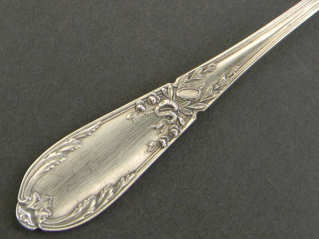 Set of 11 SFAM silver metal teaspoons.