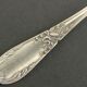 Set of 11 SFAM silver metal teaspoons.