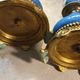 Pair of xixth candle holders, in bronze and enamelled porcelain