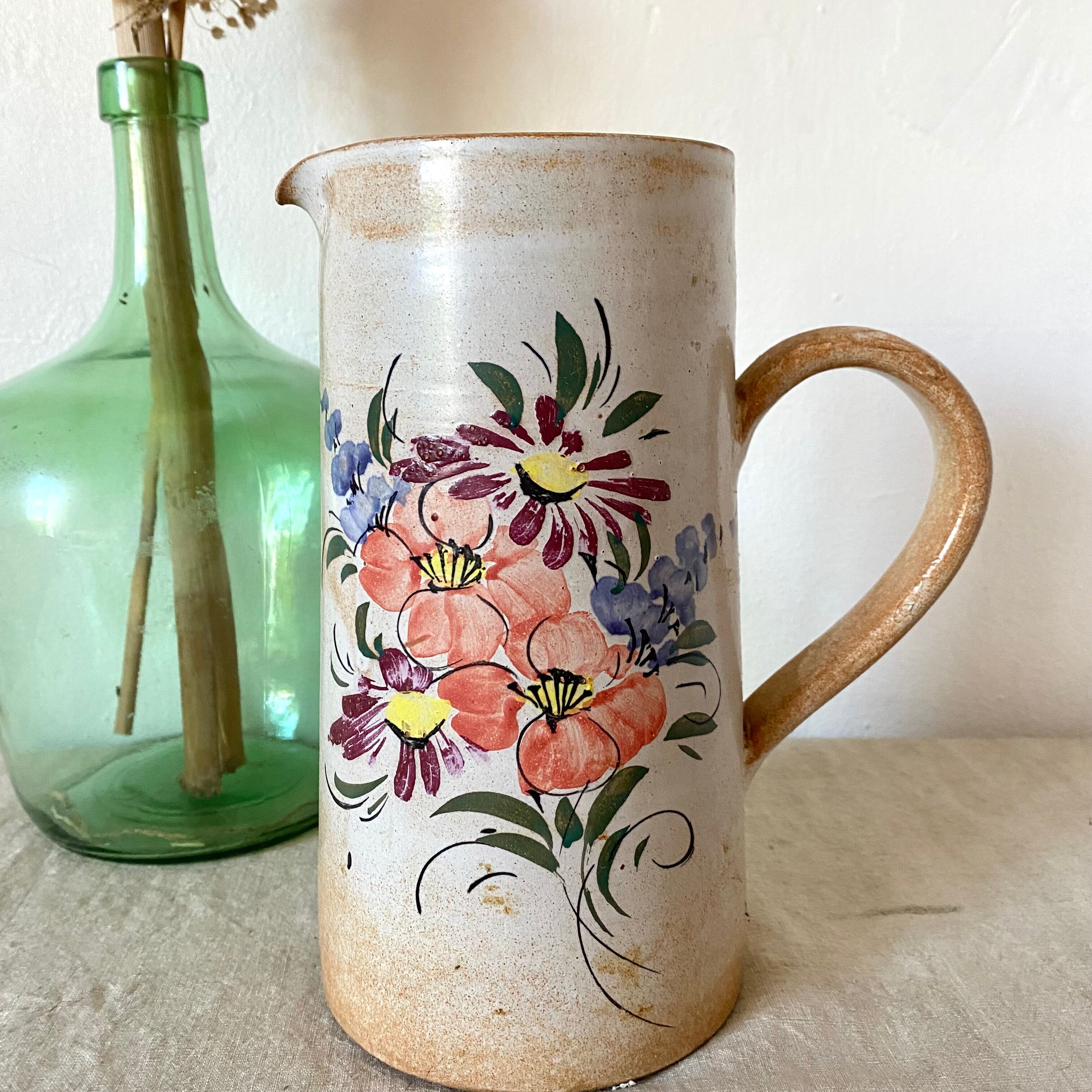 Stoneware pitcher with floral decoration