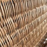 Vintage wicker trunk with burgundy metal closures