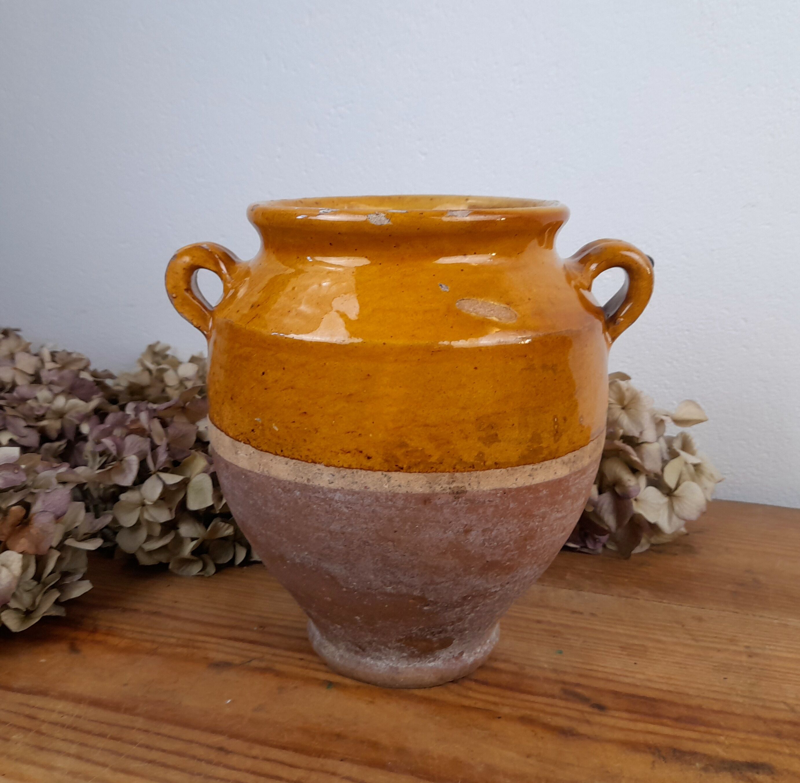 Old glazed terracotta grease pot