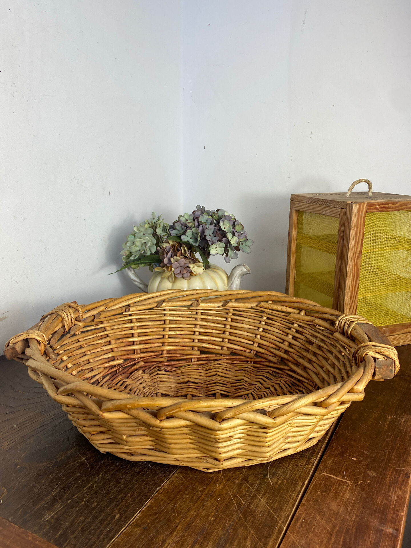 Wicker basket with wooden handles