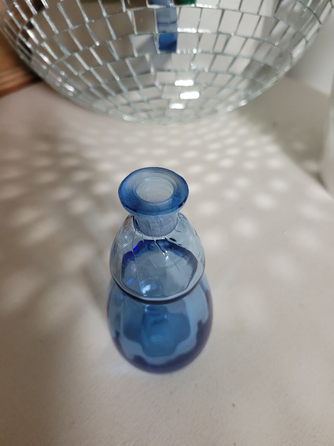 Small blown blue glass bottle