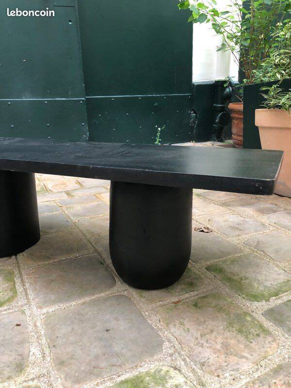 Rectangular coffee table in stained black wood with ball and cylindrical legs.