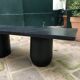 Rectangular coffee table in stained black wood with ball and cylindrical legs.