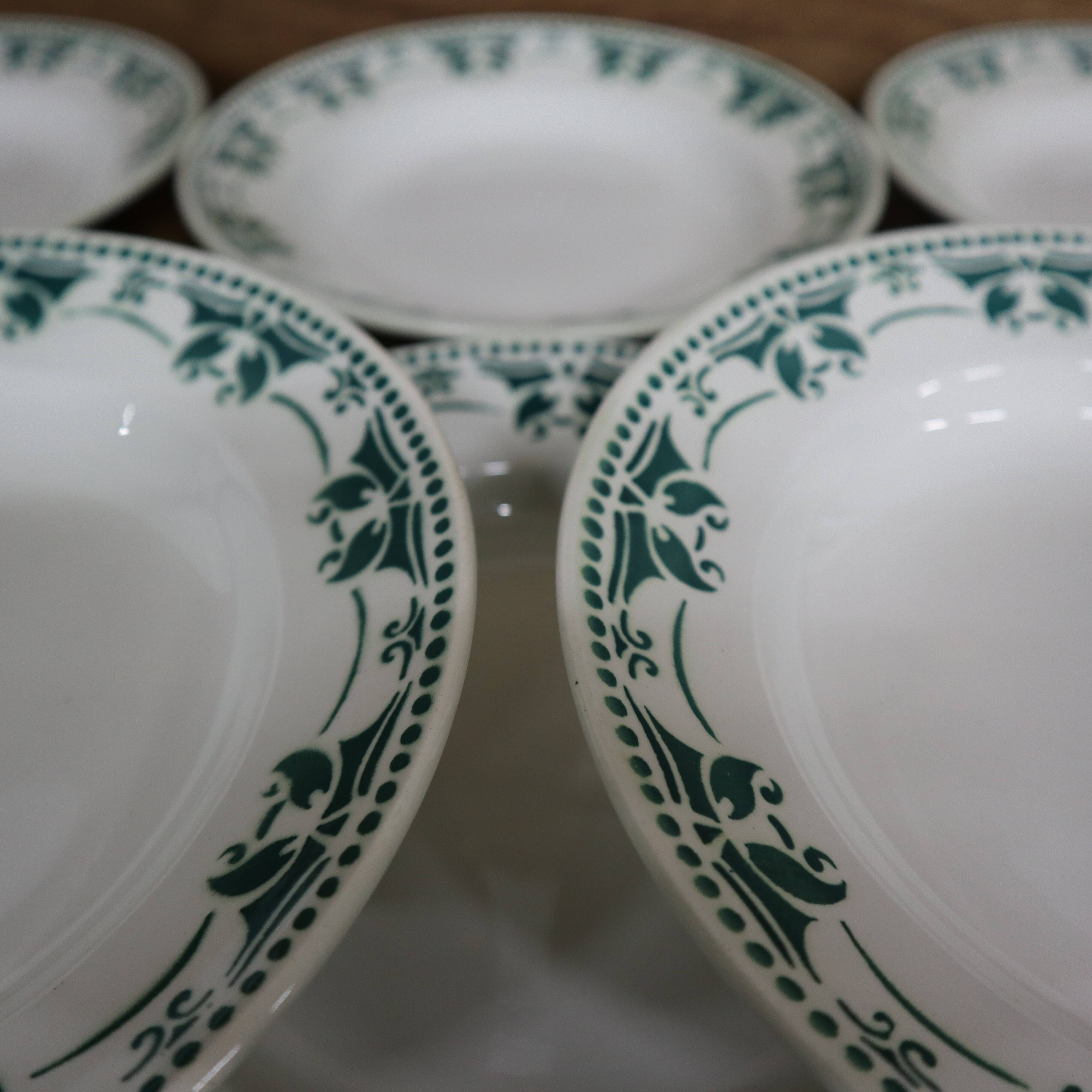 11 white and green earthenware soup plates from Saint Amand Terre de Fer