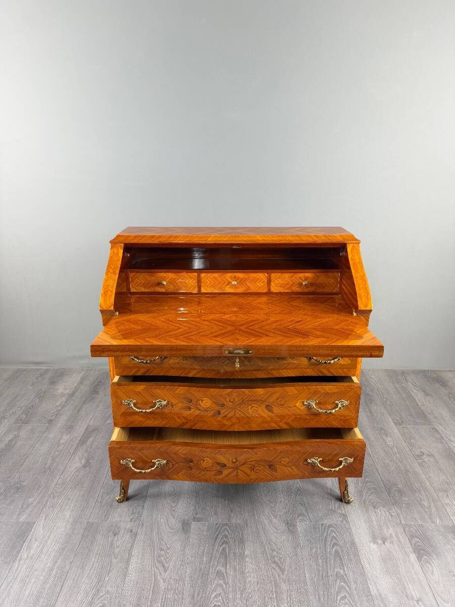 Louis XV style writing desk with a drop-leaf, made of veneer and marquetry, 19th century.