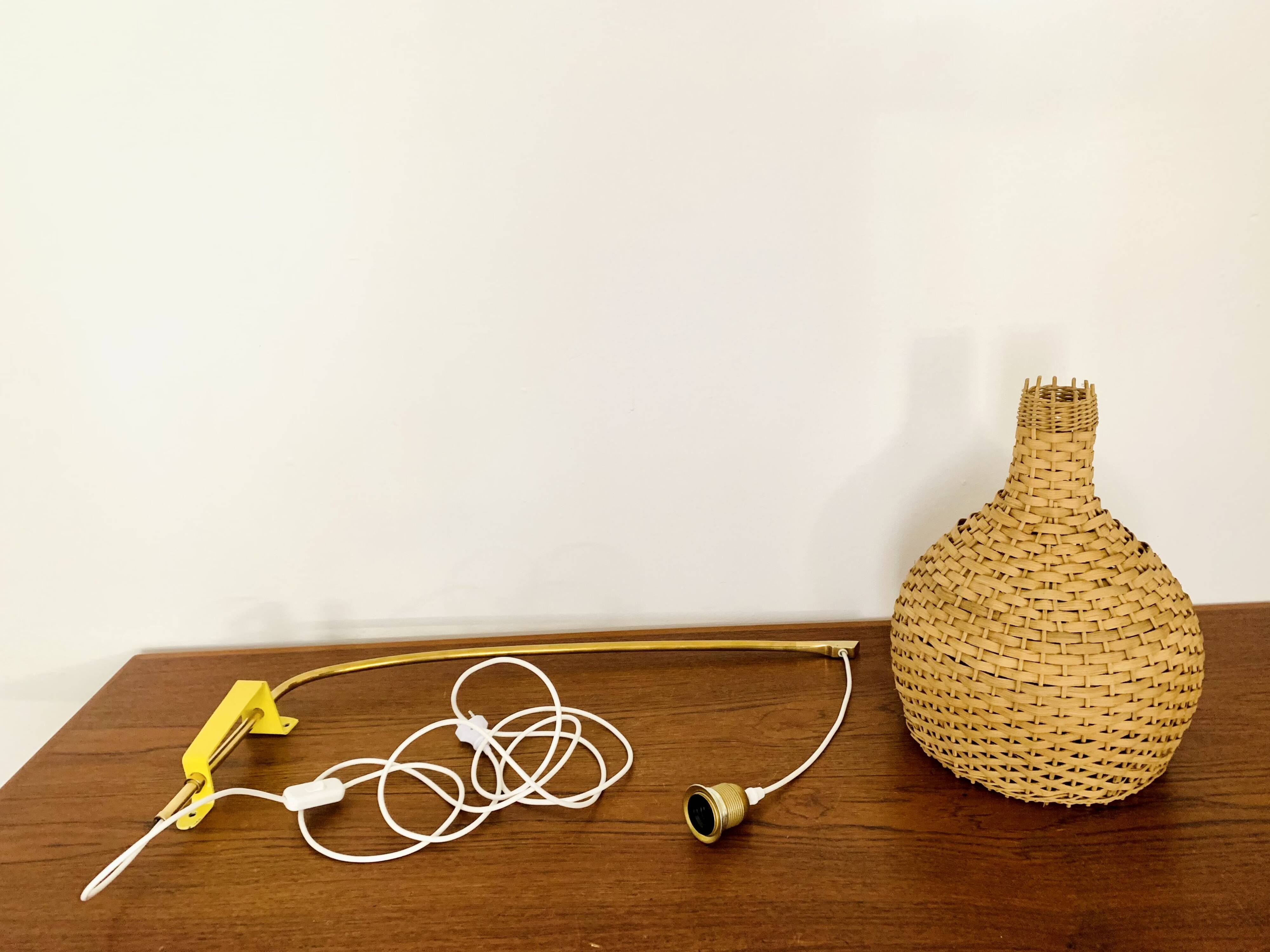 Adjustable Brass and Wicker Arc Sconce