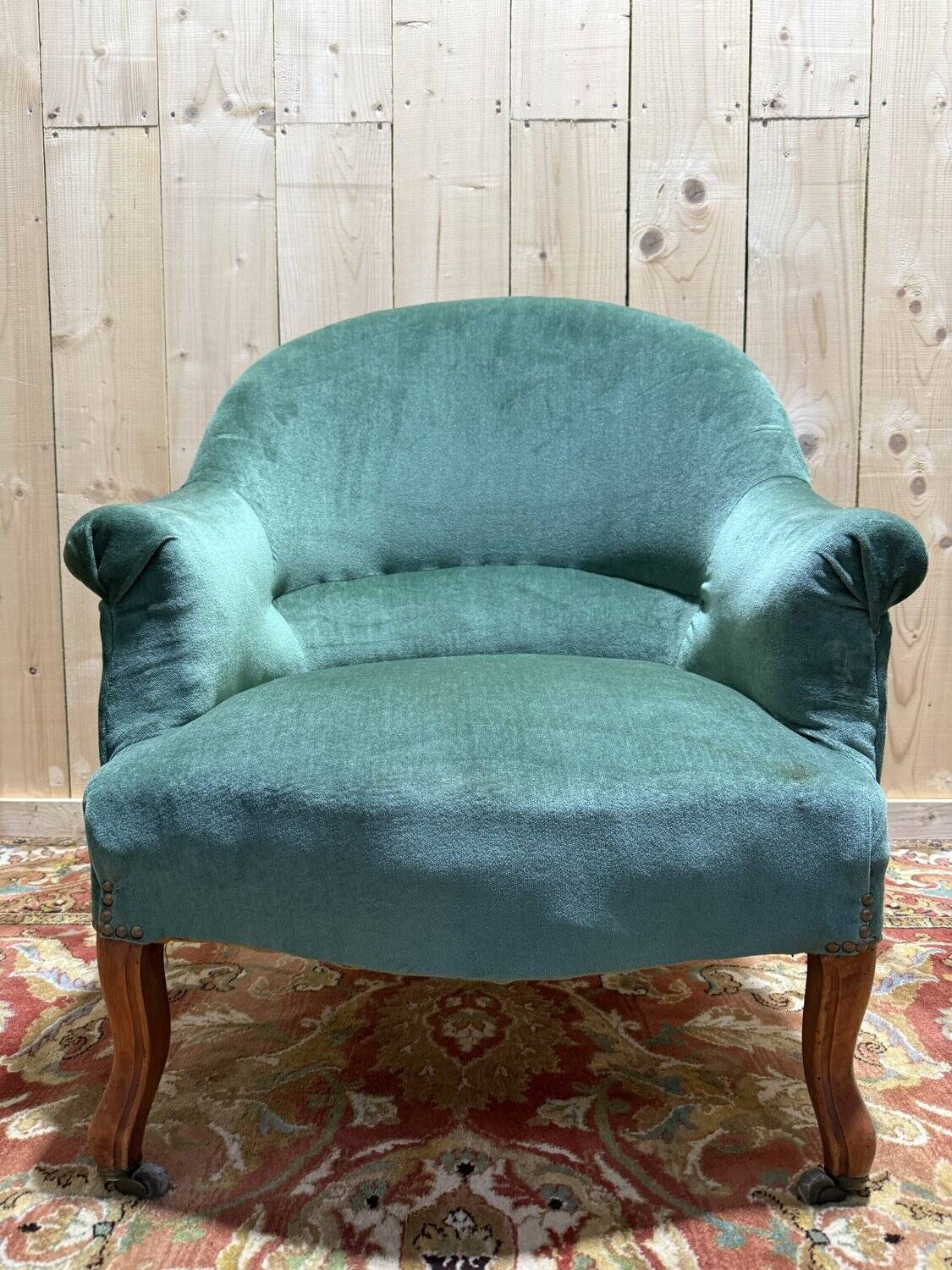 Napoleon III period crapaud armchair in green velvet.