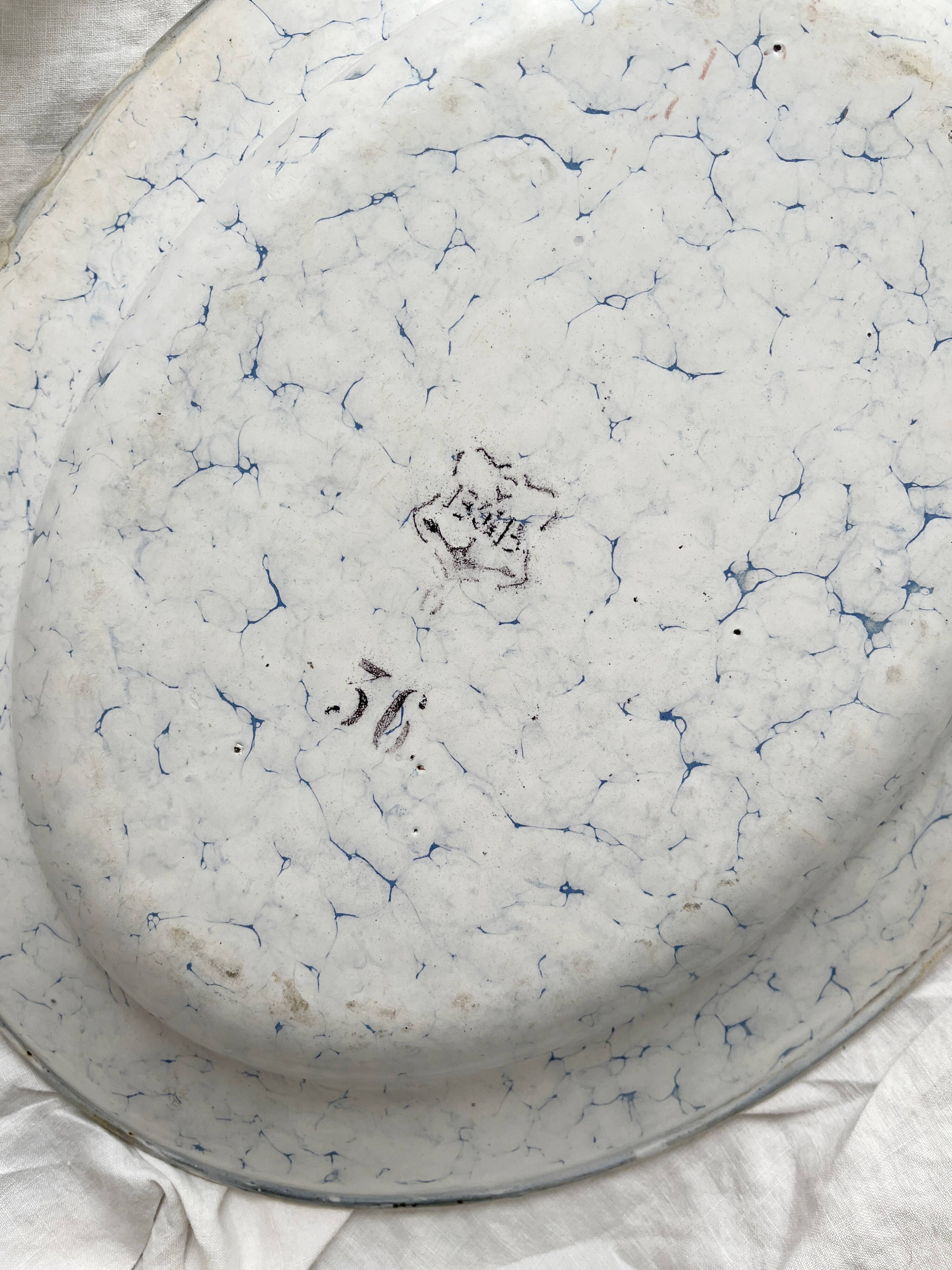 Vintage marbled white and blue enameled sheet metal oval dish