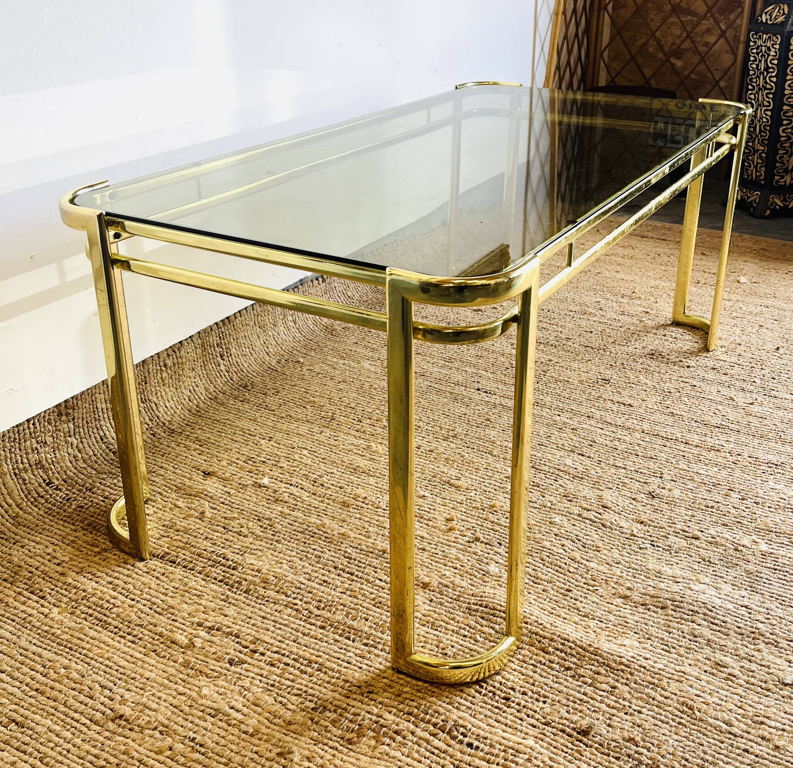 Gold metal and smoked glass coffee table – 1970s-624001