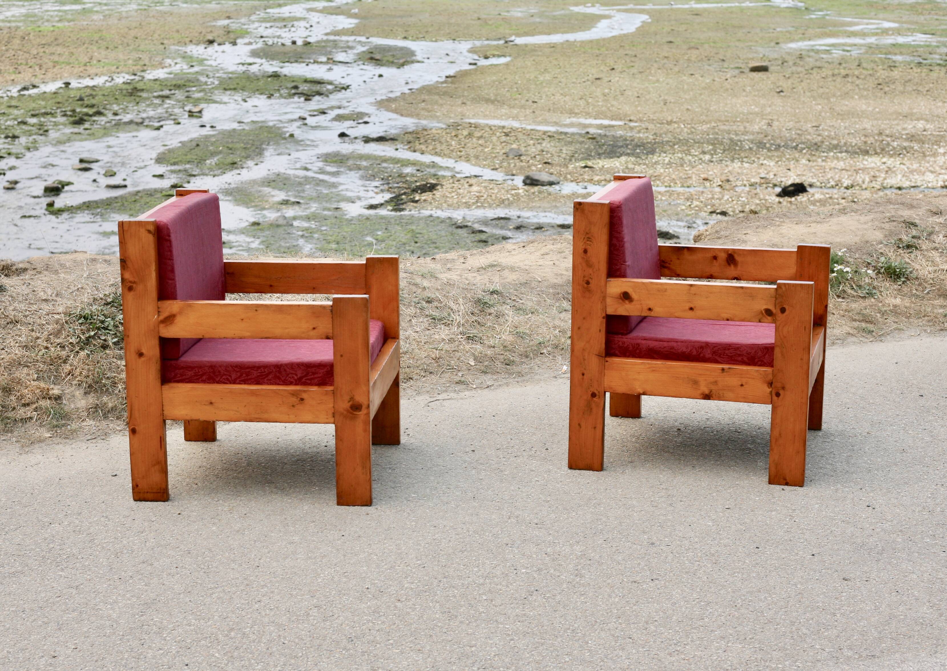 Pair of pine fireside chairs, France, 1960s, "raspberry" cushions