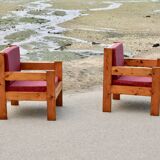 Pair of pine fireside chairs, France, 1960s, "raspberry" cushions
