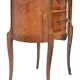 Small kidney-shaped chest of drawers in Transition style.