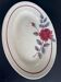 Oval plate Moulin des Loups in blue and red ceramic with a floral design.