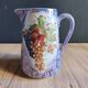 Vintage porcelain pitcher Lusseray France, decorated with grape clusters.