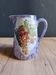 Vintage porcelain pitcher Lusseray France, decorated with grape clusters.