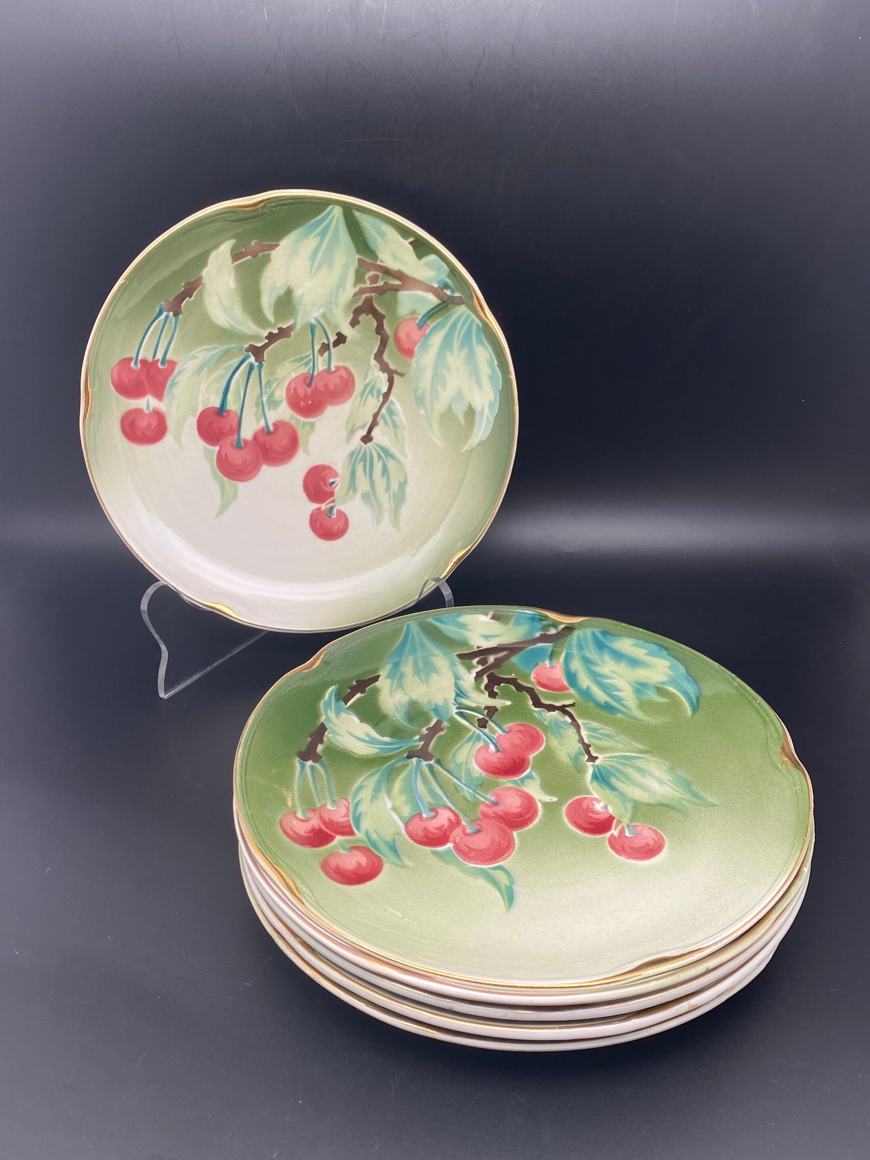 Lunéville cherry plates with golden edges