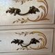 Curved Louis XV style commode in marble with painted floral decoration.