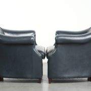 Set of dark blue cow leather club armchairs with a unique design