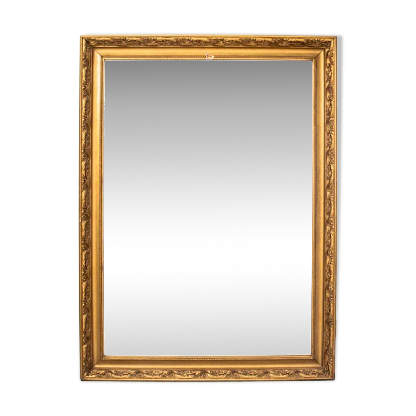 A mirror in a golden frame
