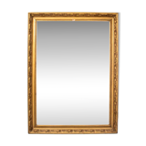 A mirror in a golden frame