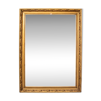 A mirror in a golden frame