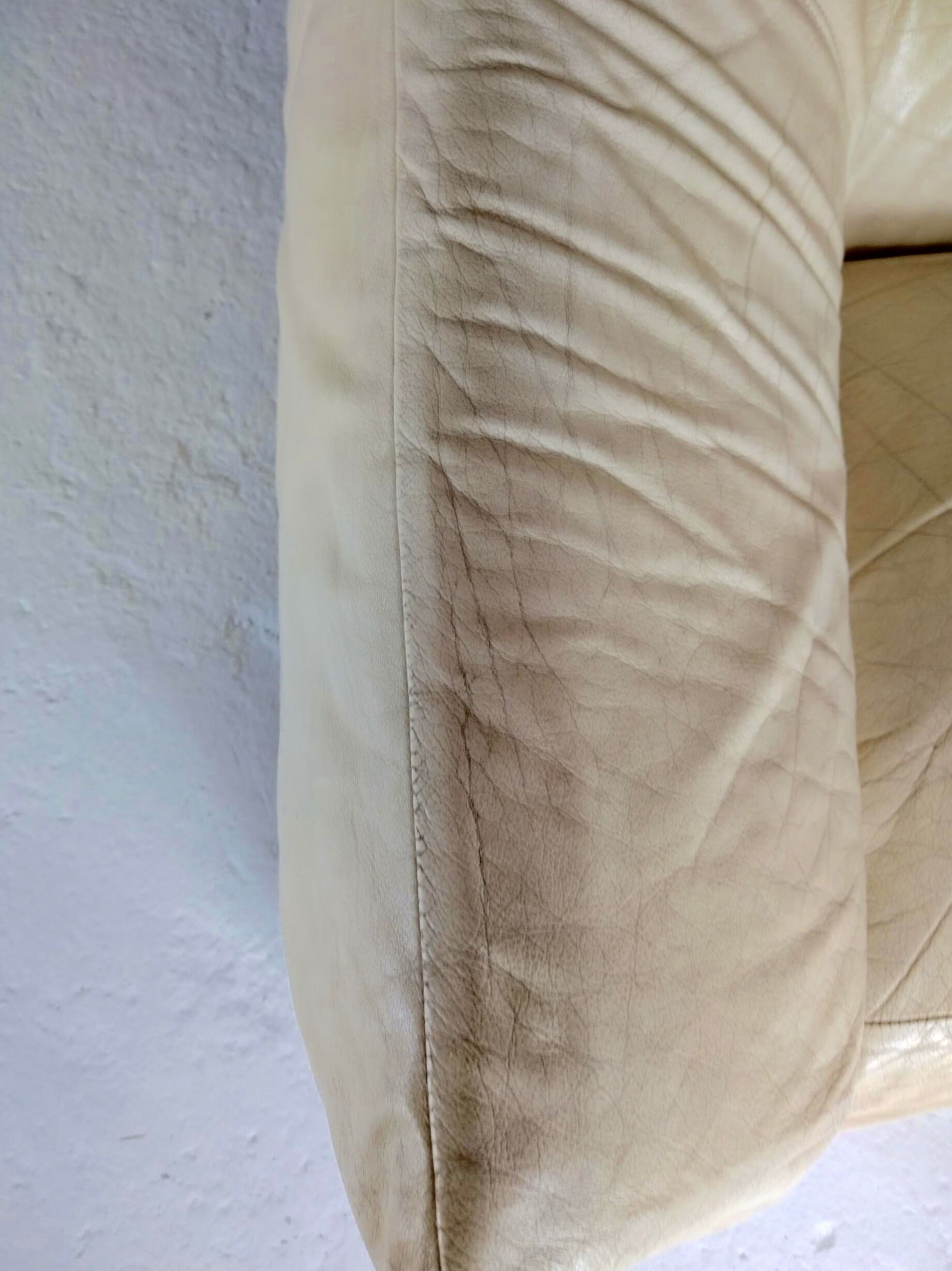 Leather armchair and cream-coloured foam, France , circa 1970