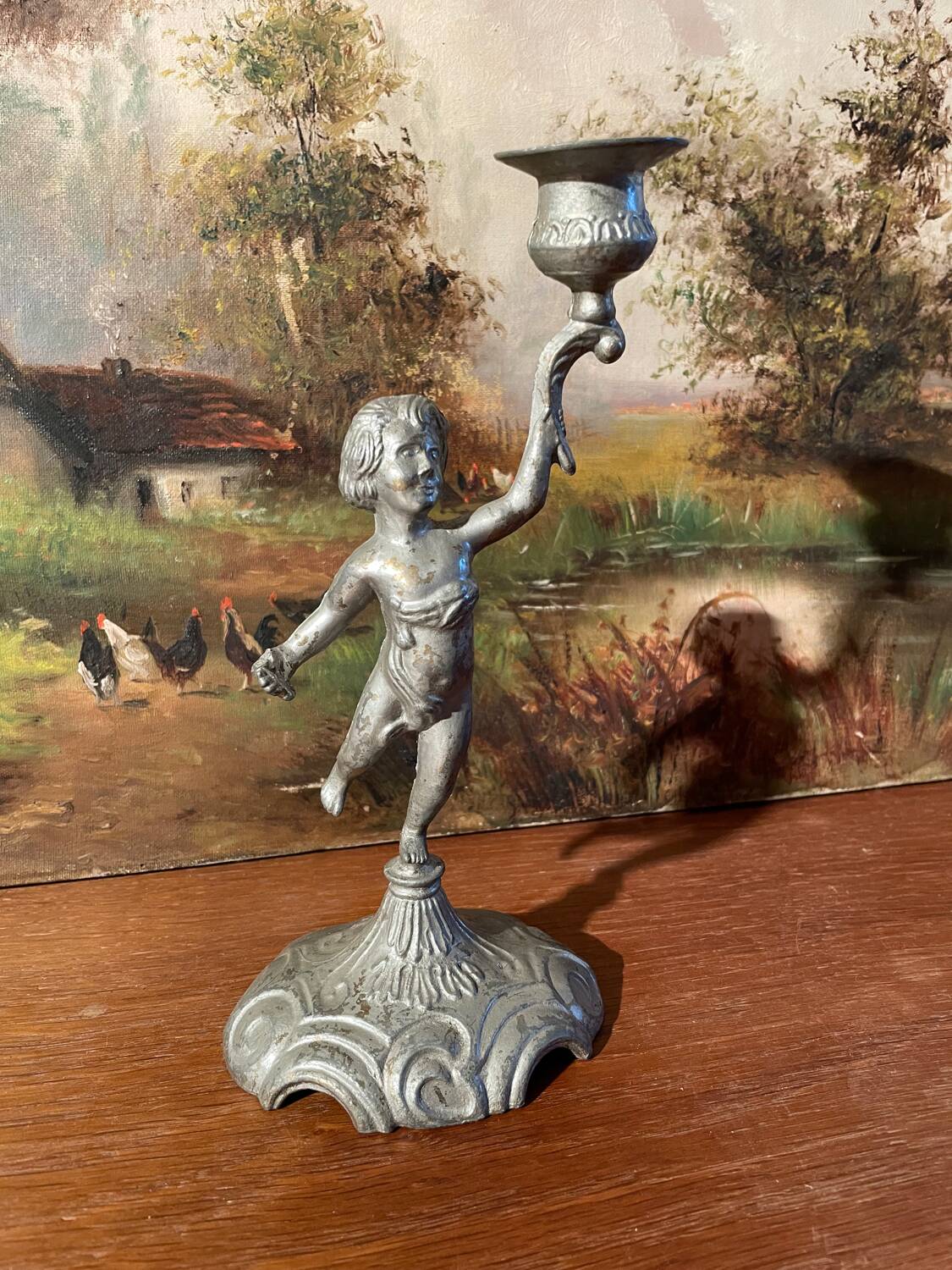 Old cherub candle holder