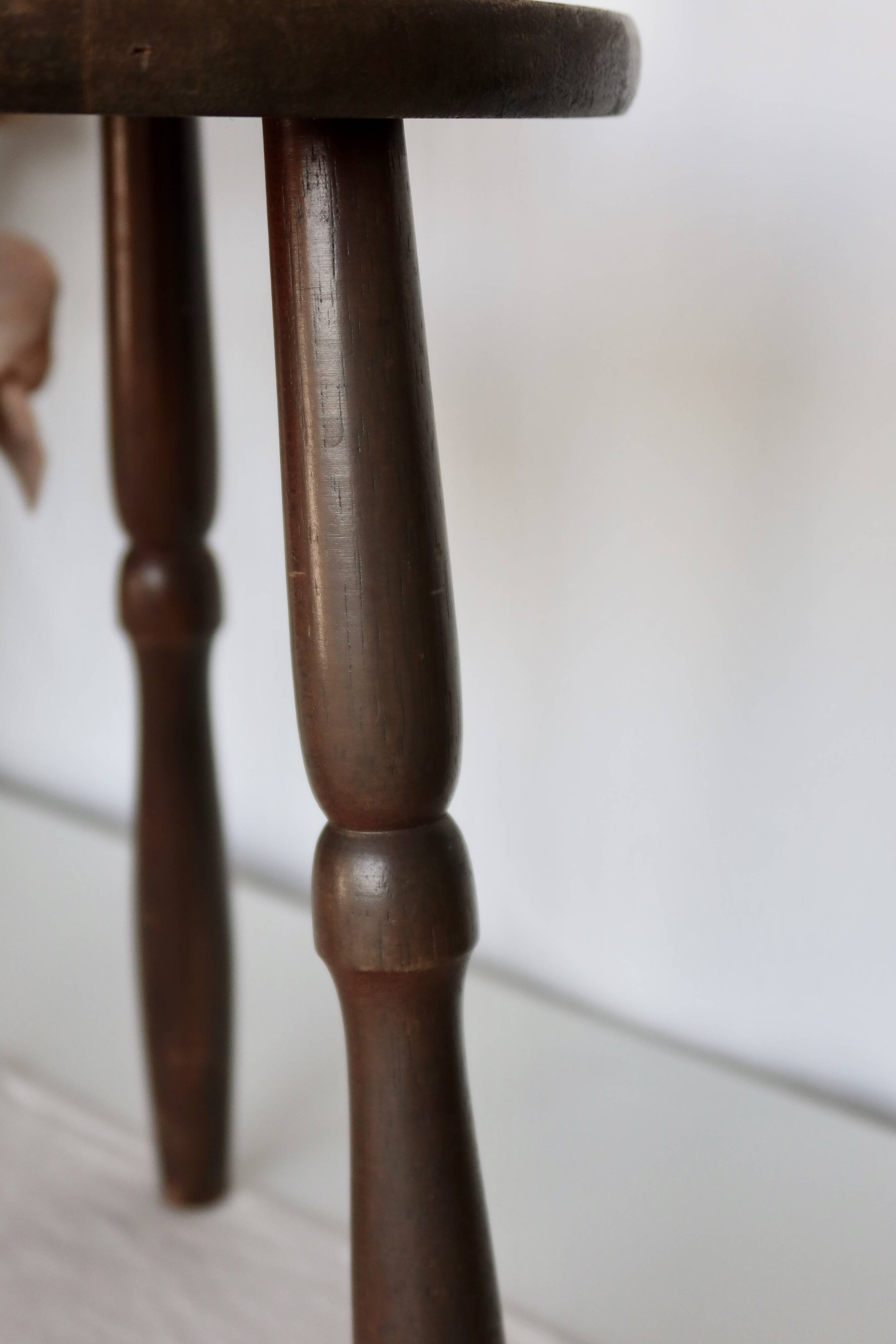 Antique tripod stool in turned wood