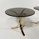 Brass and smoked glass side tables from the 1960s.