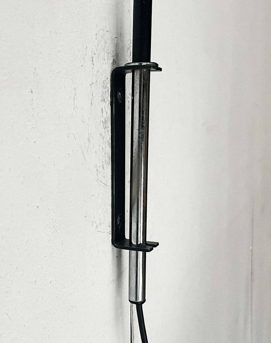 Mid-century modern Danish extendable cantilever wall lamp with a rattan shade, 1960s.