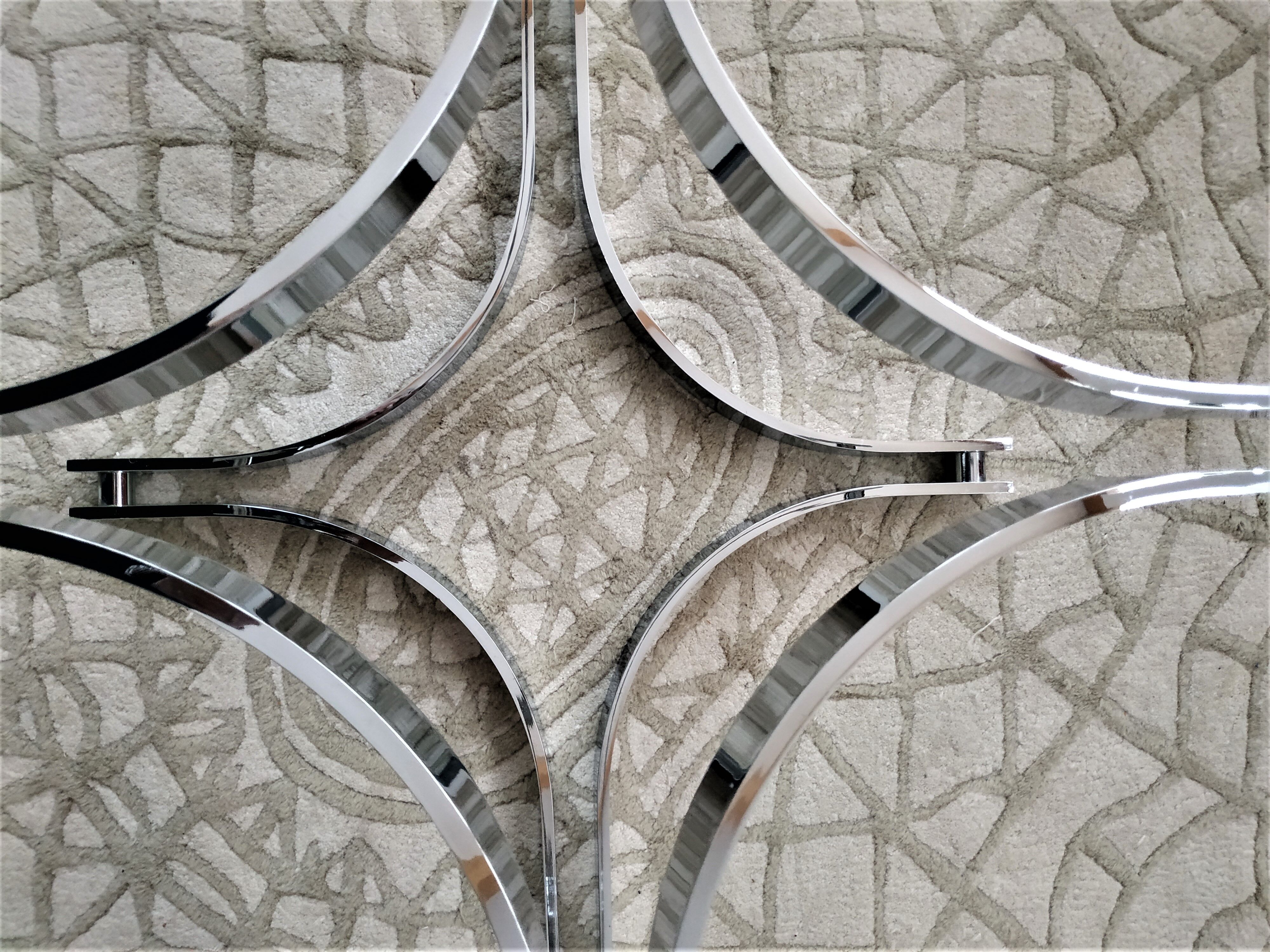 Chrome metal coffee table and oval smoked glass tray