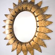 Miroir «Sun Mirror» espagnol des années 60, en métal doré.