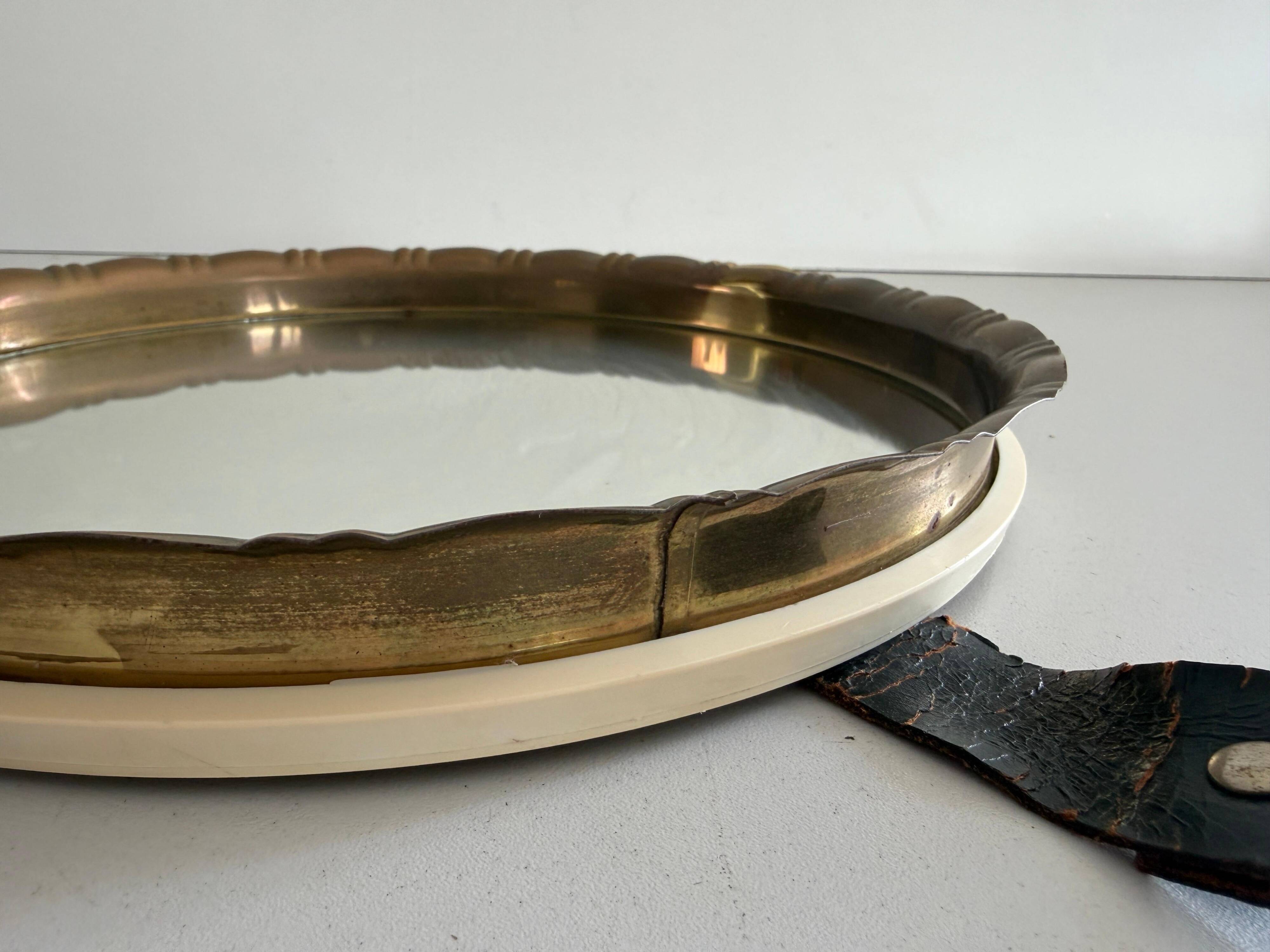 Round wall mirror with brass frame and leather hanger, 1960, Germany