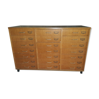Furniture has vintage school drawers