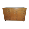 Furniture has vintage school drawers