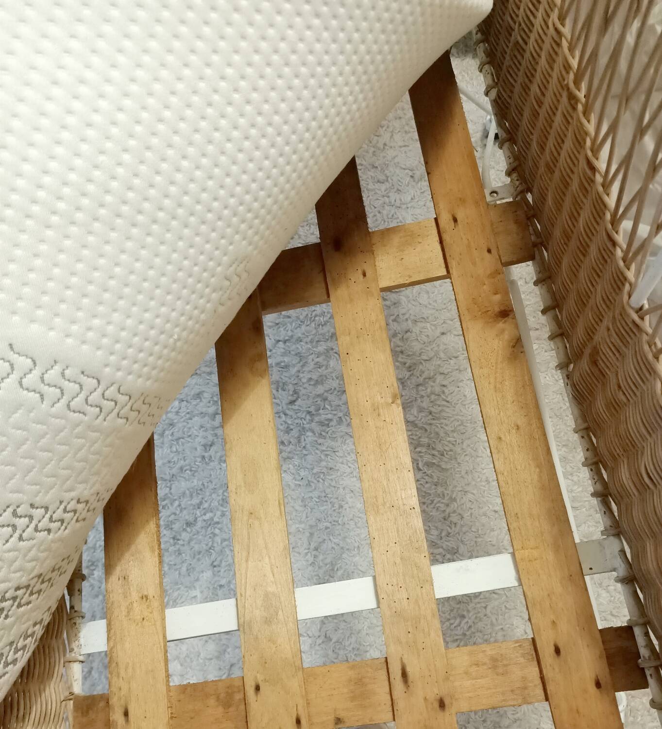 Rattan and wrought iron cradle