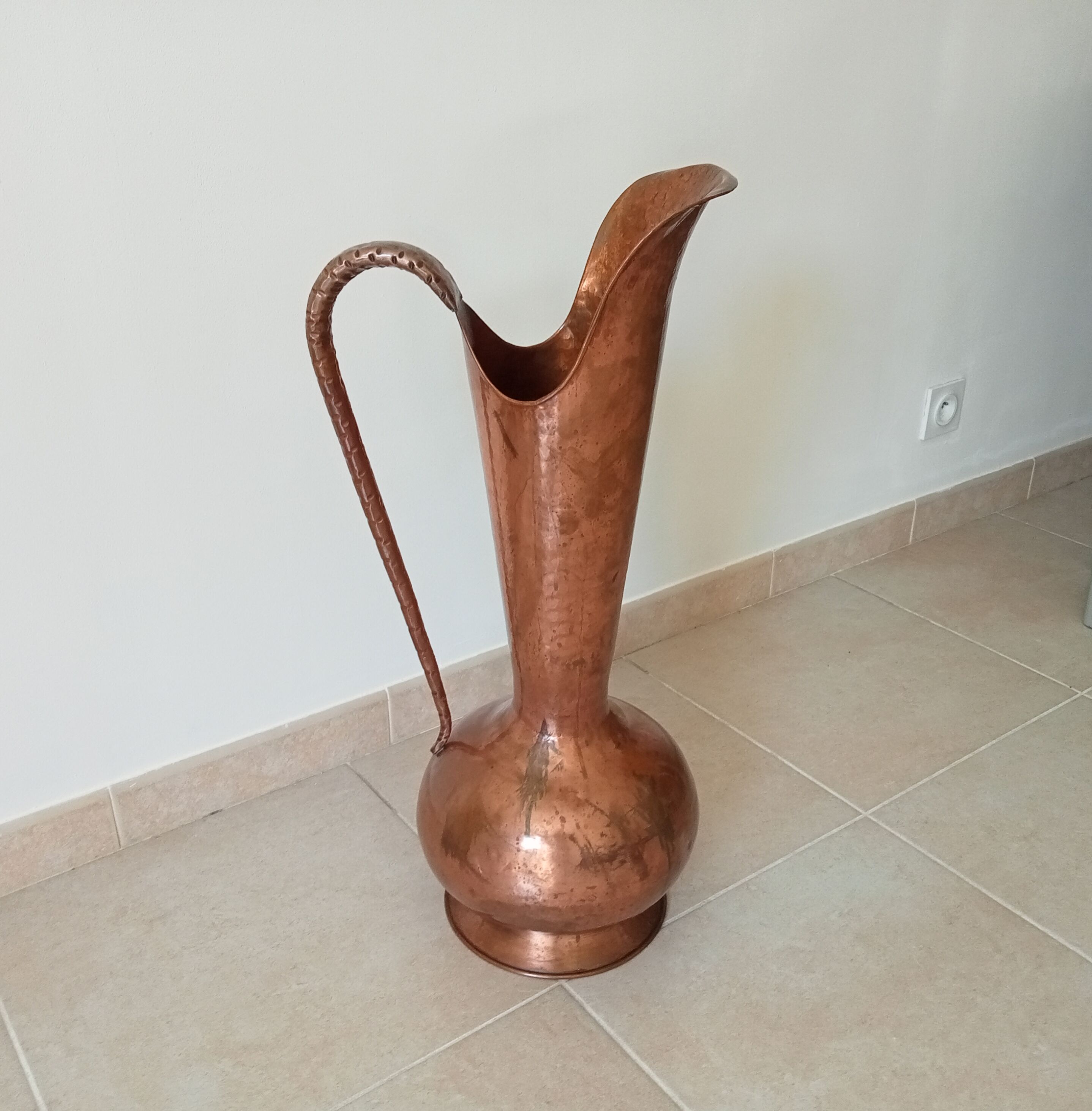 Old italian amphora vase in hammered copper