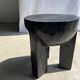 Black mango wood tripod side table with a semi-spherical top, height: 45 cm, diameter: 44 cm.